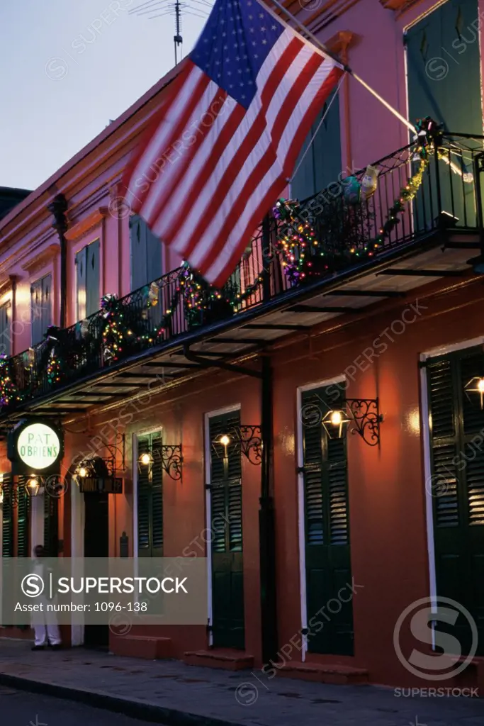 American flag leaning over a bar, Pat O'Brien's Bar, New Orleans, Louisiana, USA