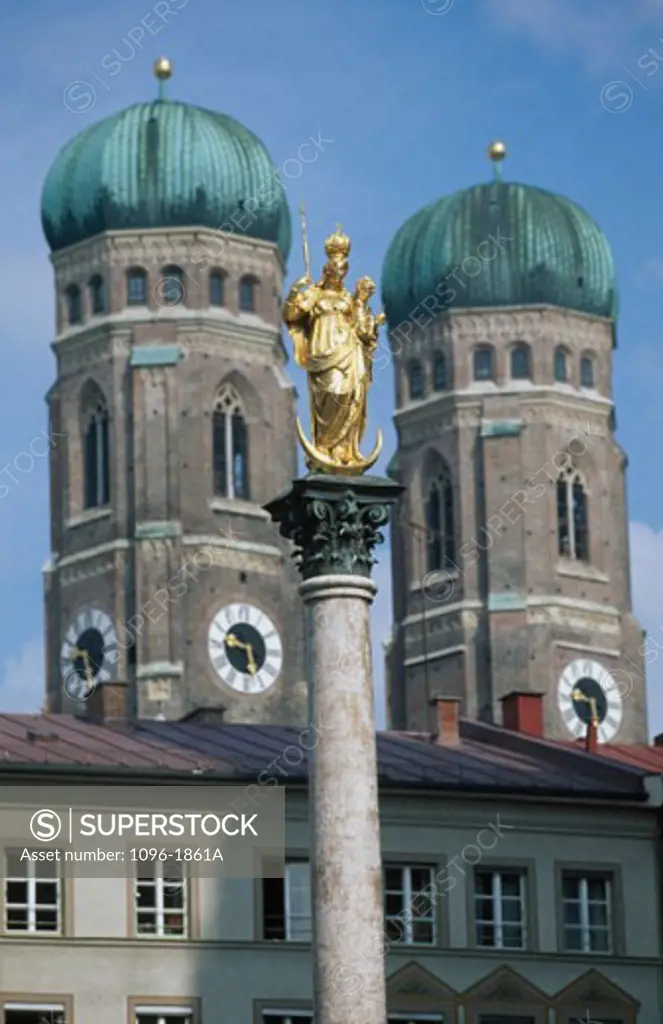 Low angle view of a statue in front of a cathedral, Frauenkirche, Bavaria, Munich, Germany