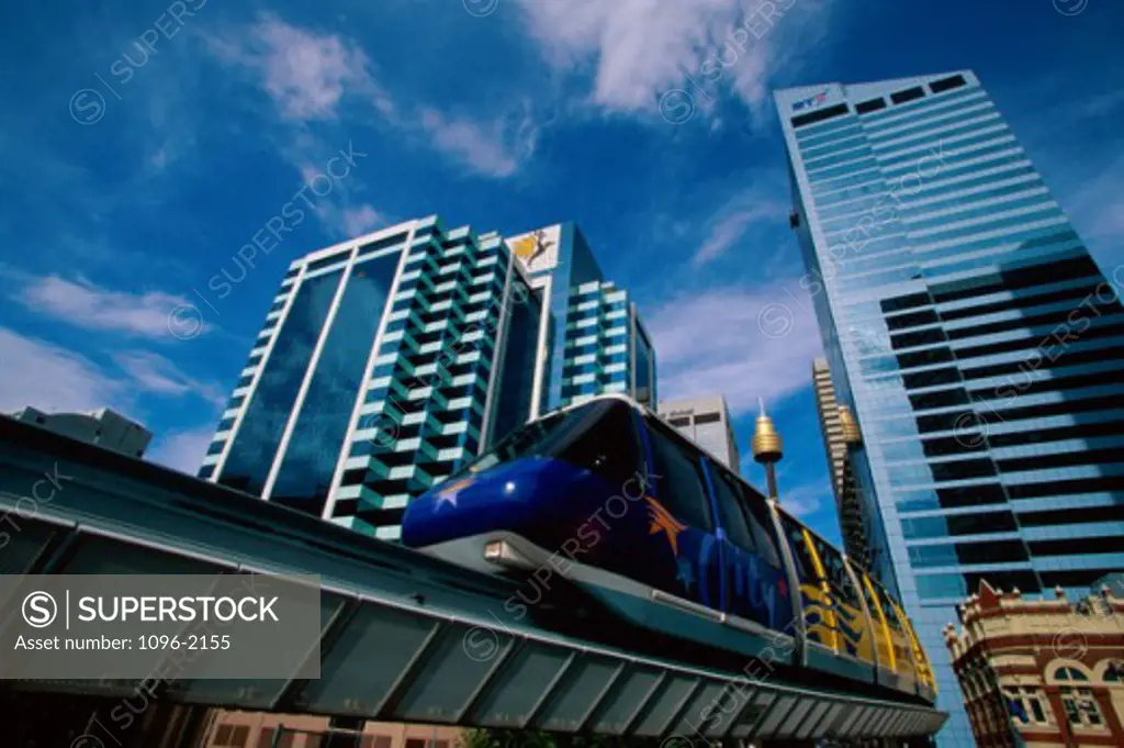Low angle view of Sydney Tower and a monorail, Sydney, Australia