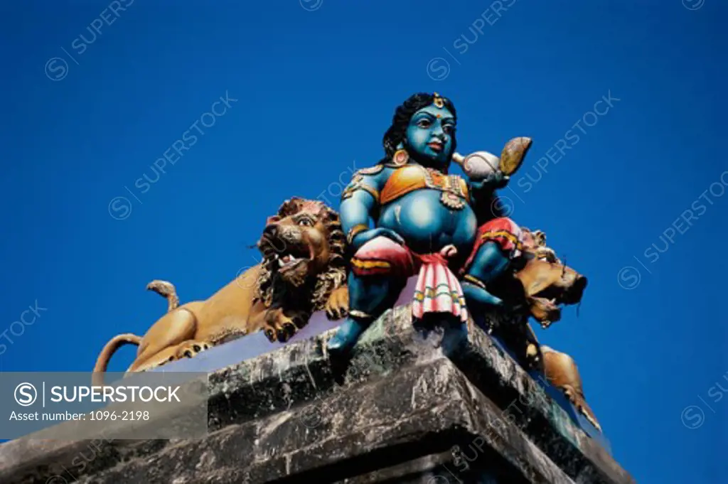 Low angle view of a statue on a rooftop, India