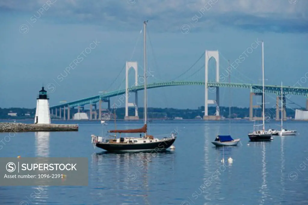 Boats docked in a harbor, Newport Pell Bridge, Newport, Rhode Island, USA