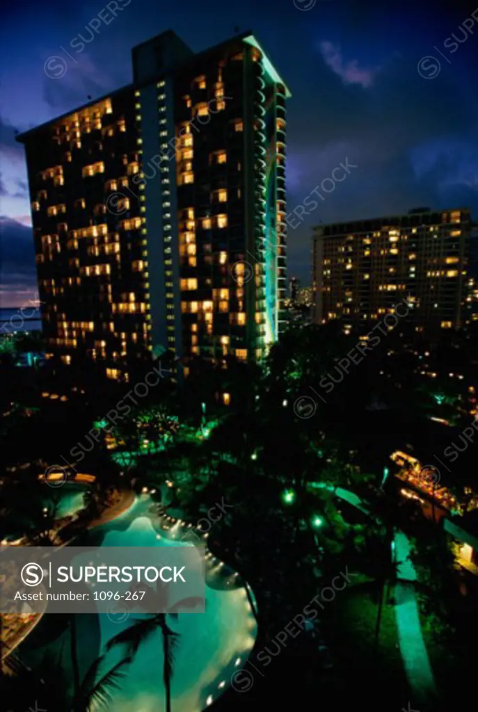 Apartment buildings lit up at night, Honolulu, Oahu, Hawaii, USA