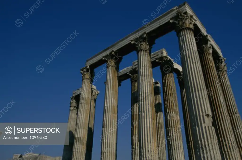 Low angle view of the old ruins of a temple, Temple of Olympian Zeus, Athens, Greece