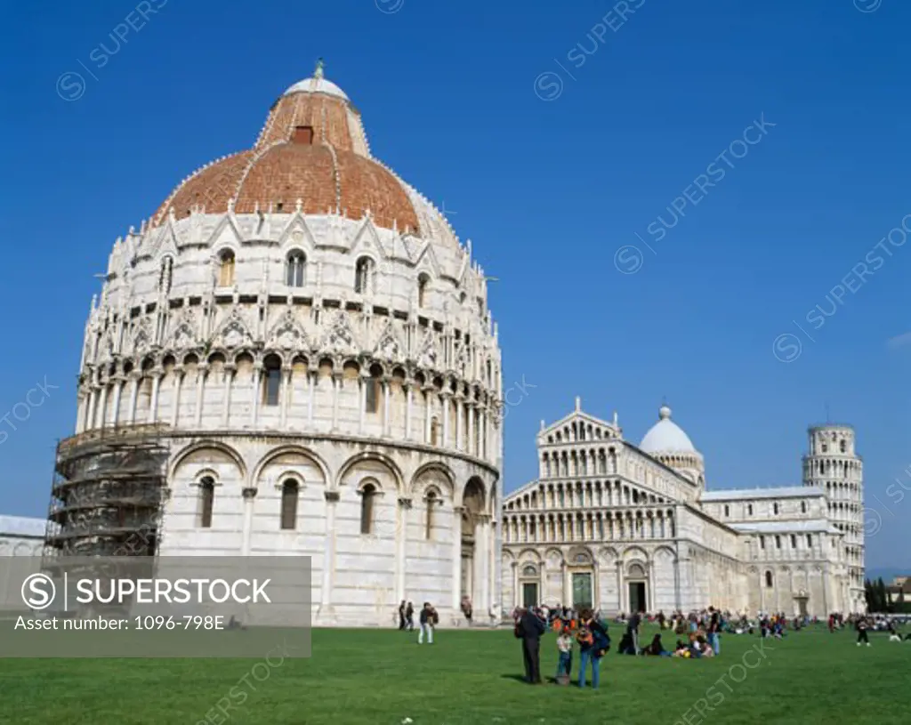 Low angle view of a baptistery in front of a cathedral, Baptistery, Duomo, Pisa, Italy