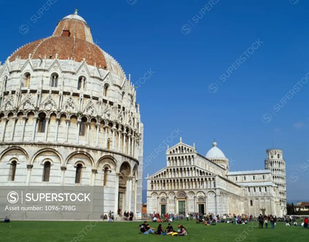Low angle view of a baptistery in front of a cathedral, Baptistery, Duomo, Pisa, Italy