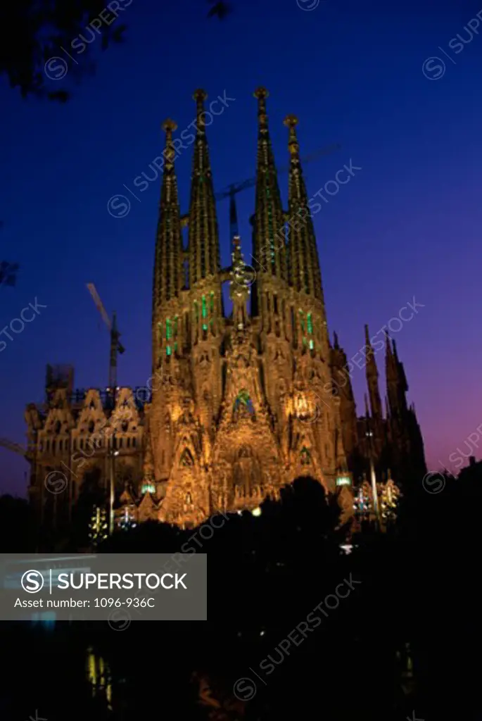 Low angle view of a basilica lit up at night, Sagrada Familia, Barcelona, Spain