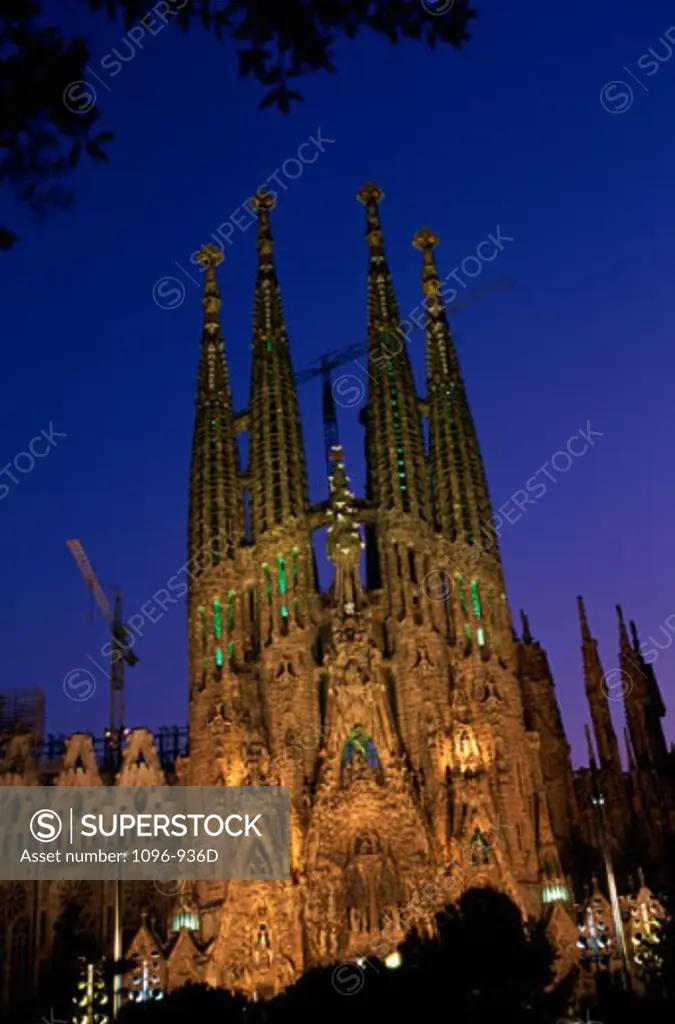 Low angle view of a basilica lit up at night, Sagrada Familia, Barcelona, Spain