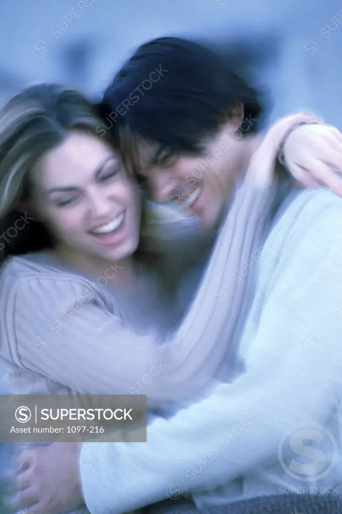 Close-up of a young couple hugging each other