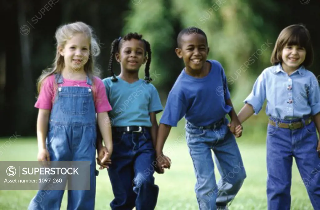 Portrait of a group of children holding hands
