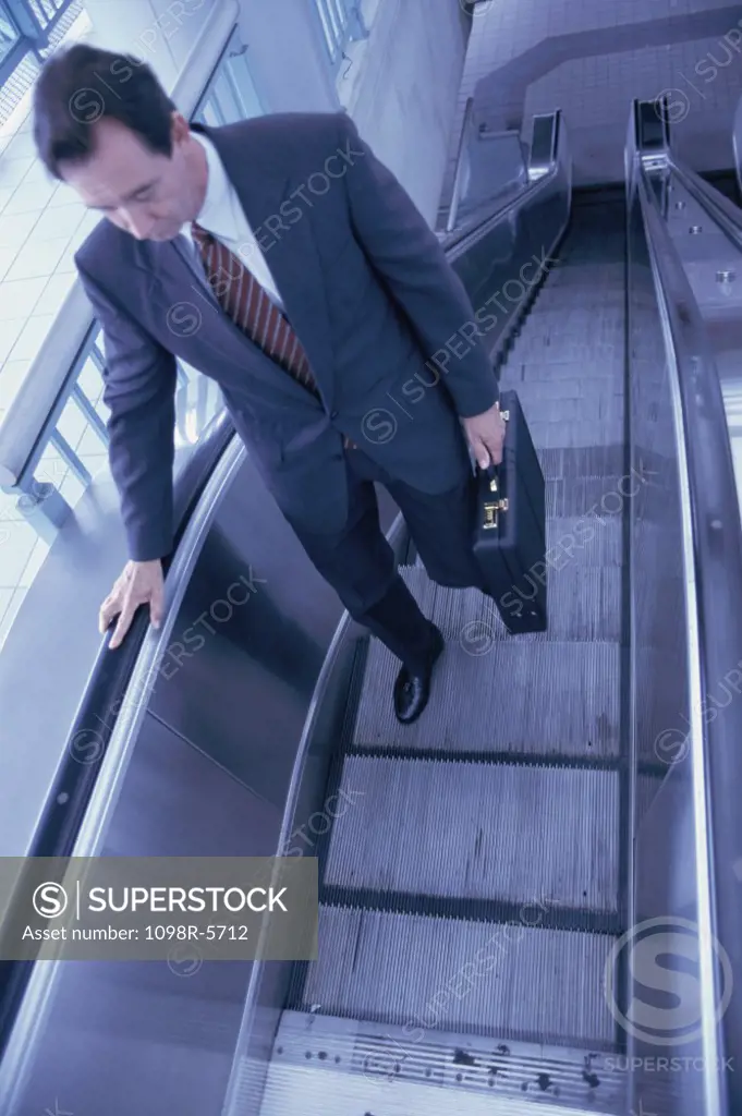 High angle view of a man on an escalator