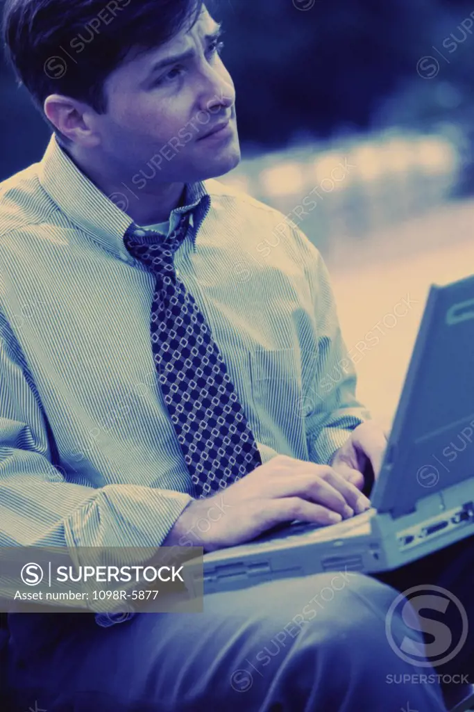 Businessman with a laptop sitting