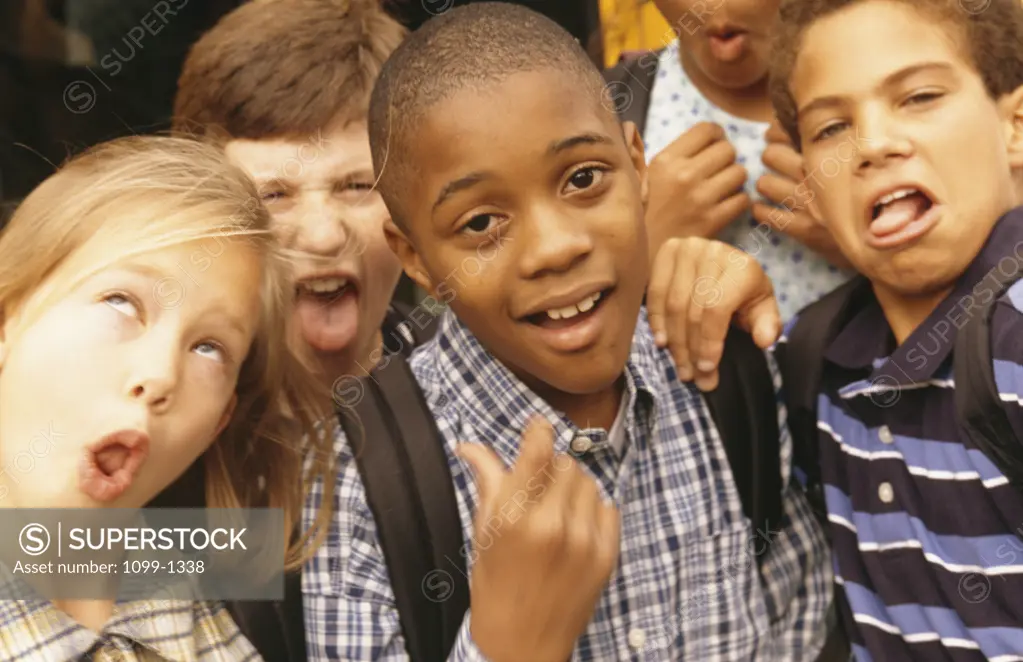 Group of children making funny faces