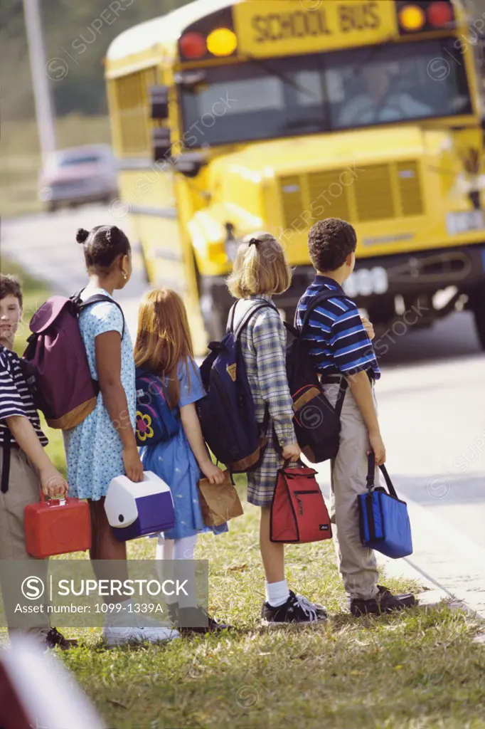 Children waiting for a school bus