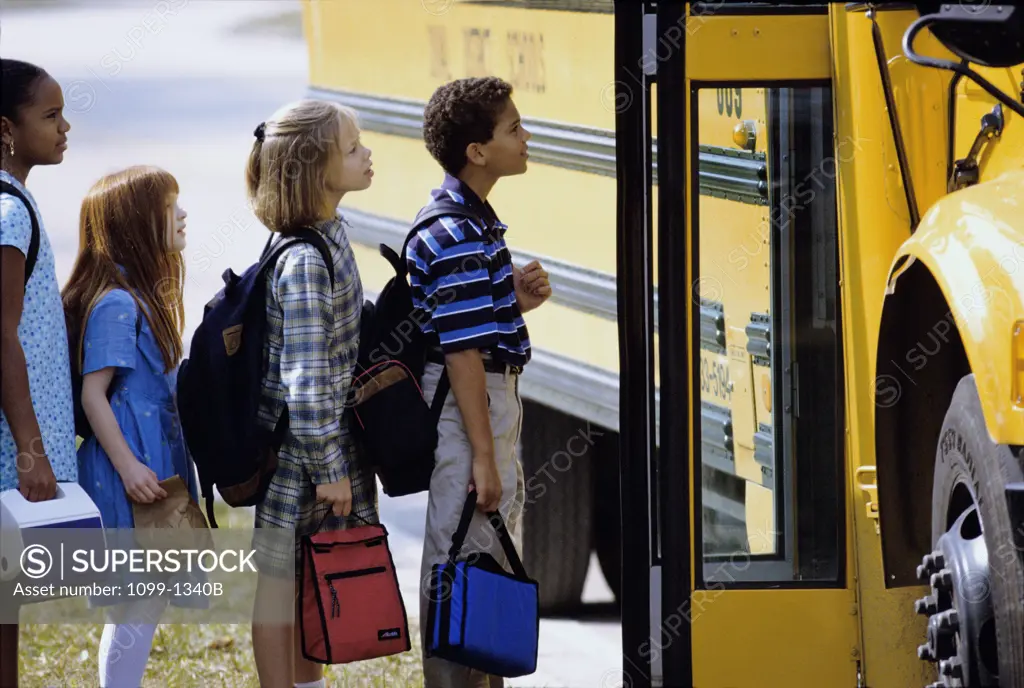 Children getting onto a school bus