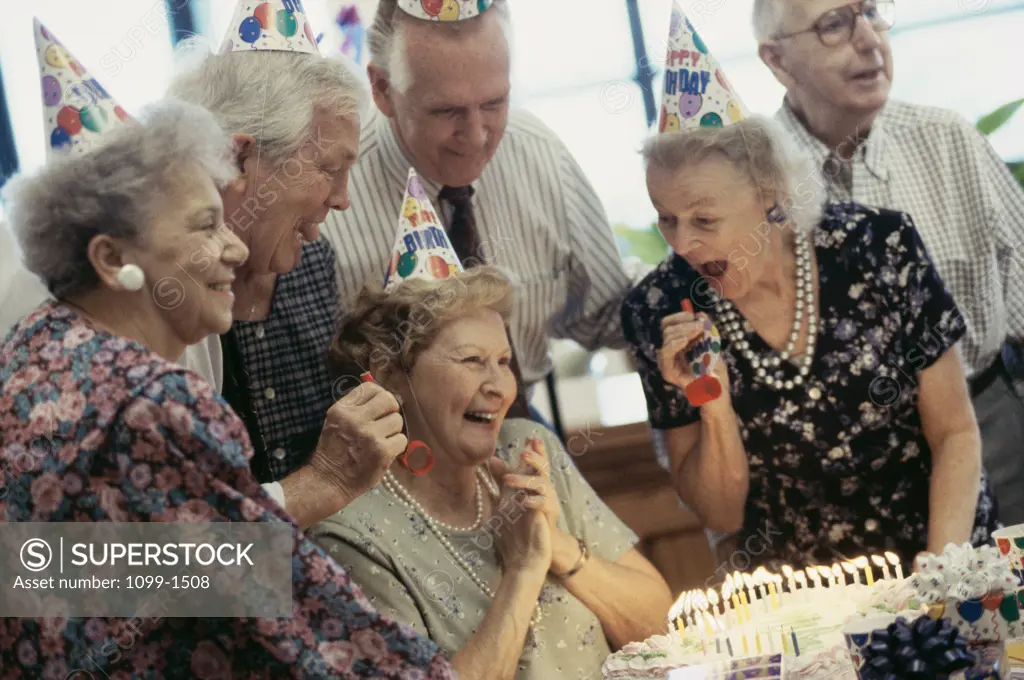 Group of senior people celebrating at a birthday party