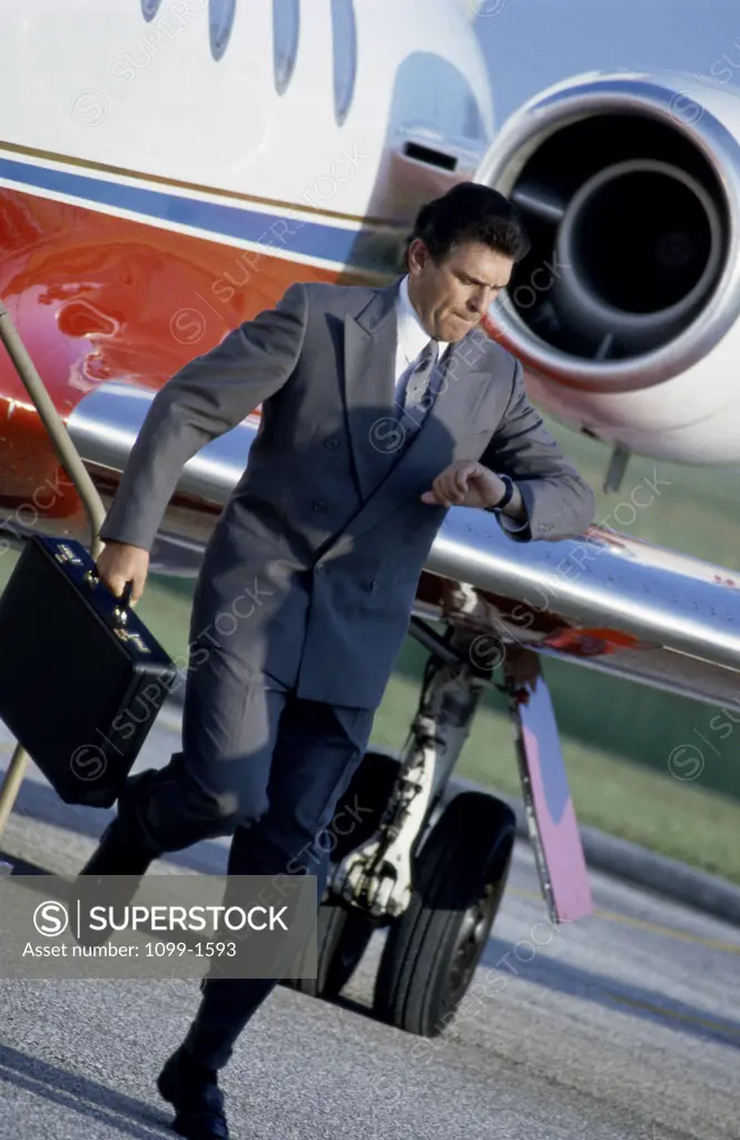 Businessman running at an airport