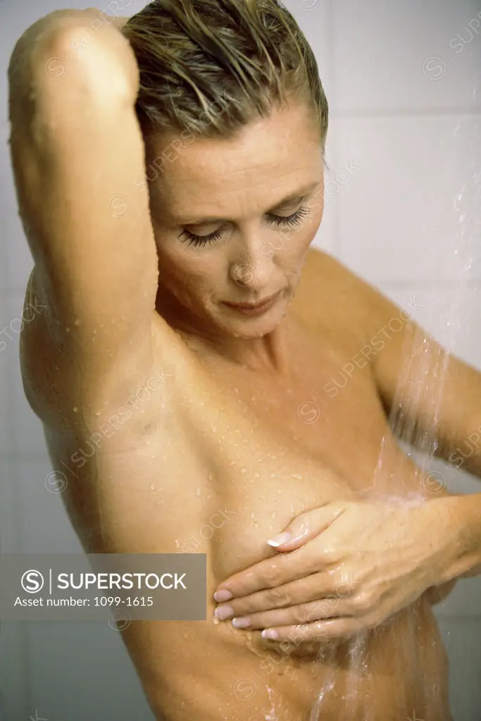 Mid adult woman in the shower