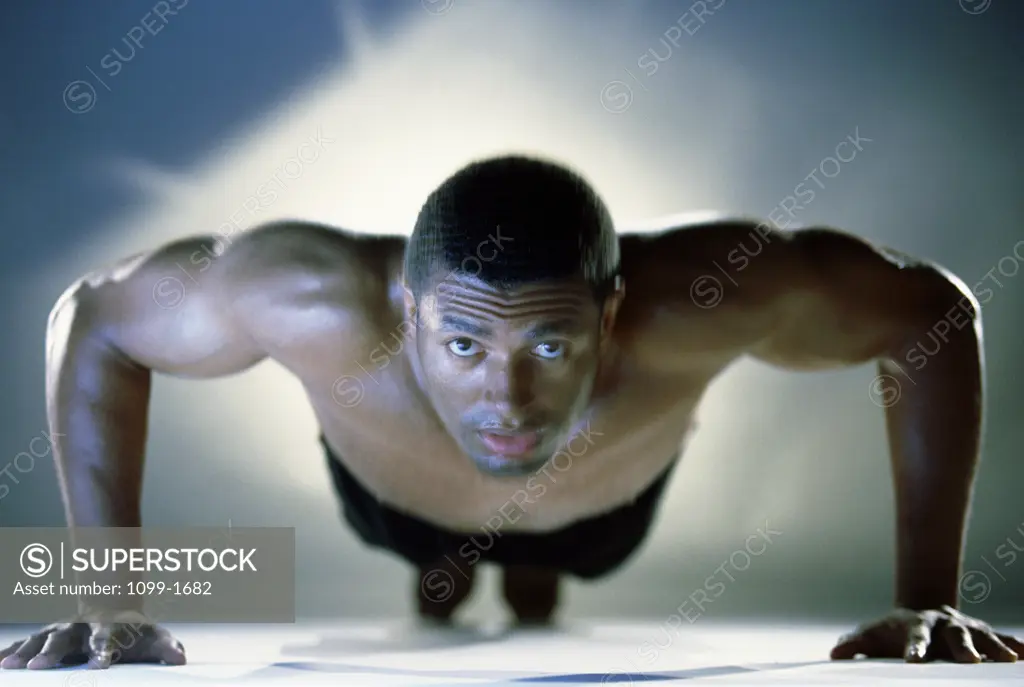 Portrait of a mid adult man exercising