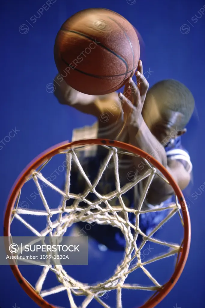 High angle view of a mid adult man playing basketball