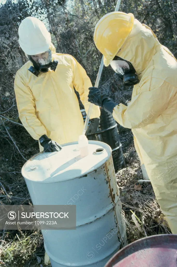 Two scientists testing toxic substances