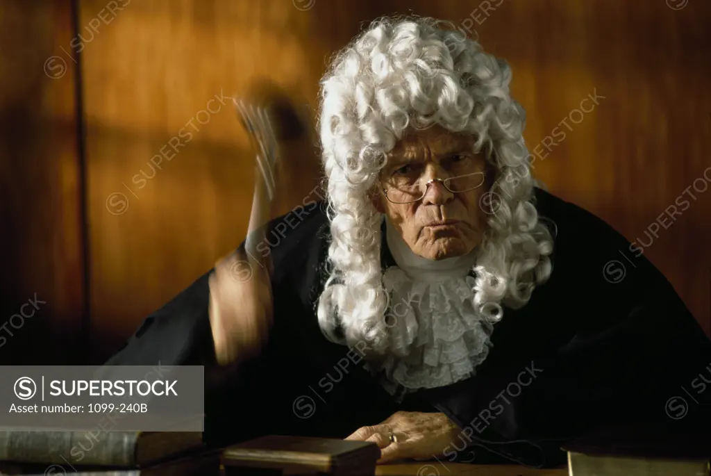Close-up of a judge holding a gavel