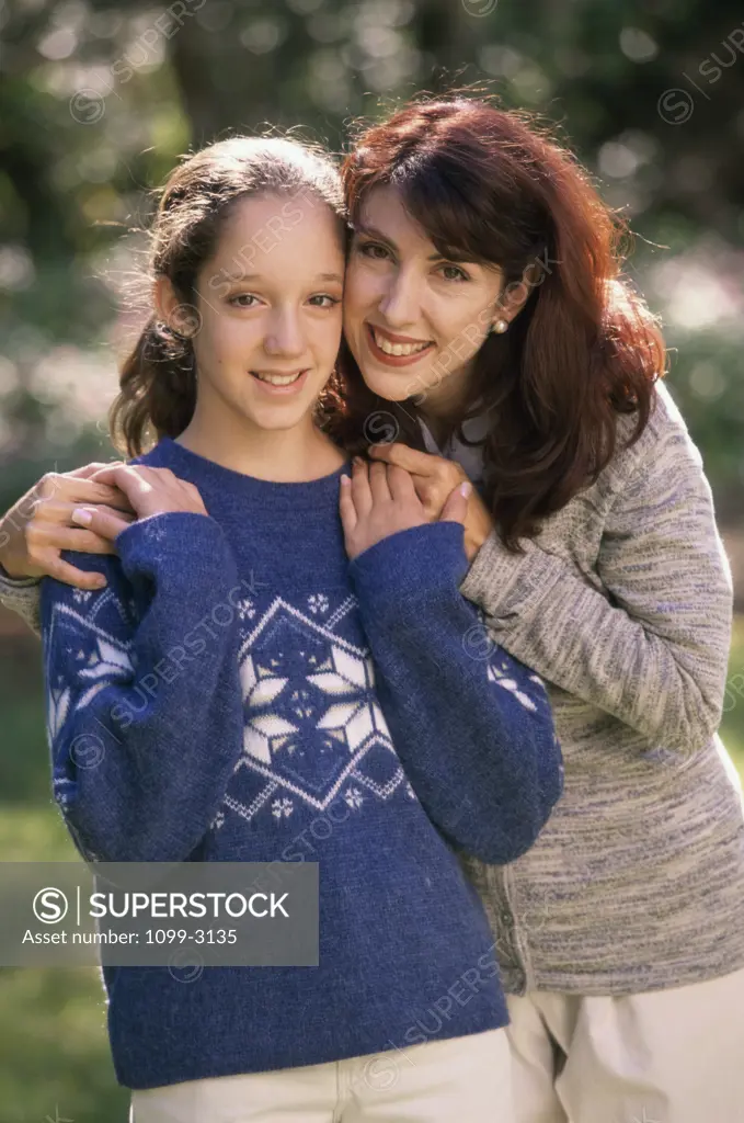 Portrait of a mother standing with her daughter