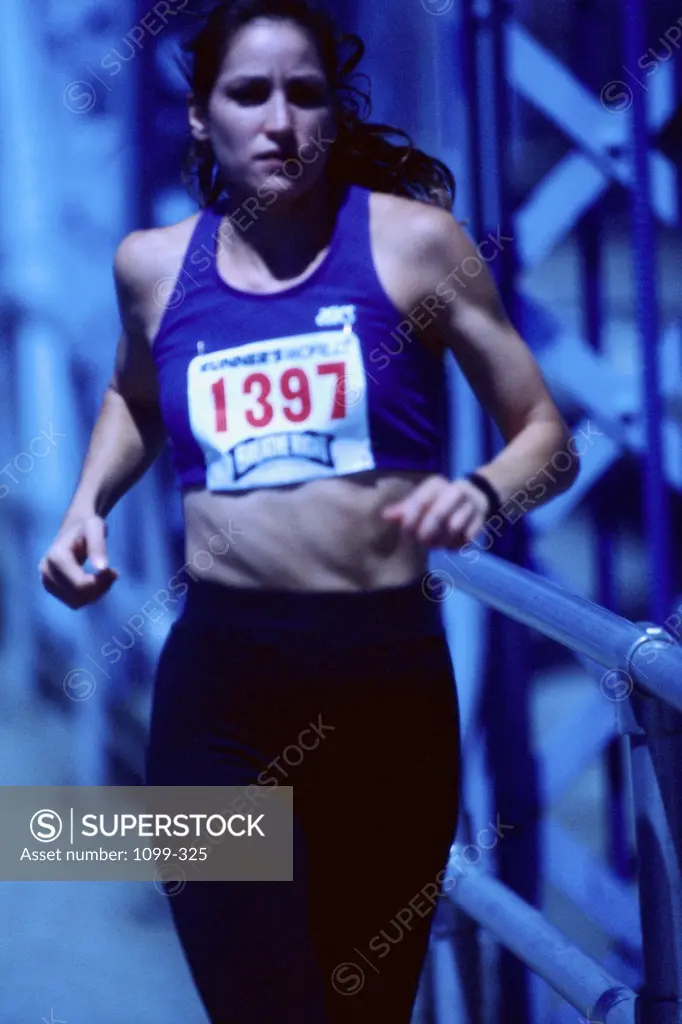 Portrait of a young woman running