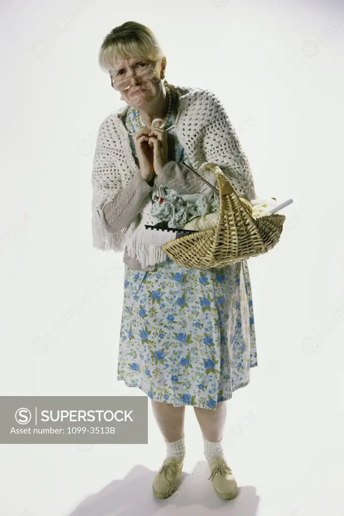 Portrait of a senior woman holding a basket