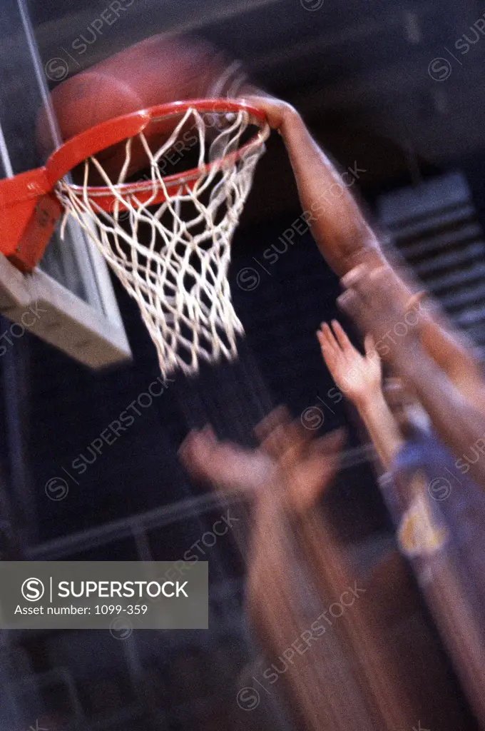 Human hands with a basketball hoop