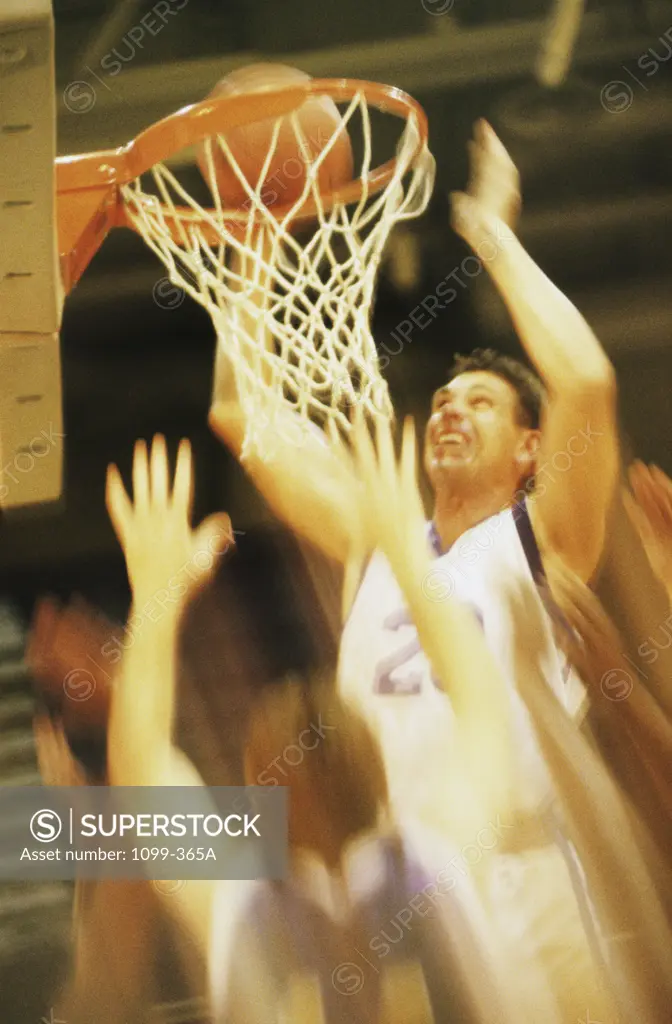 Group of young men playing basketball