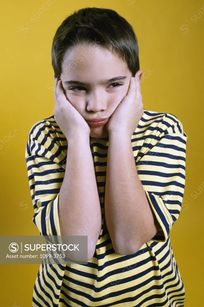 Close-up of a boy looking sad