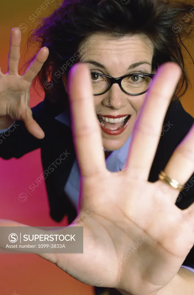 Portrait of a businesswoman holding out her hands