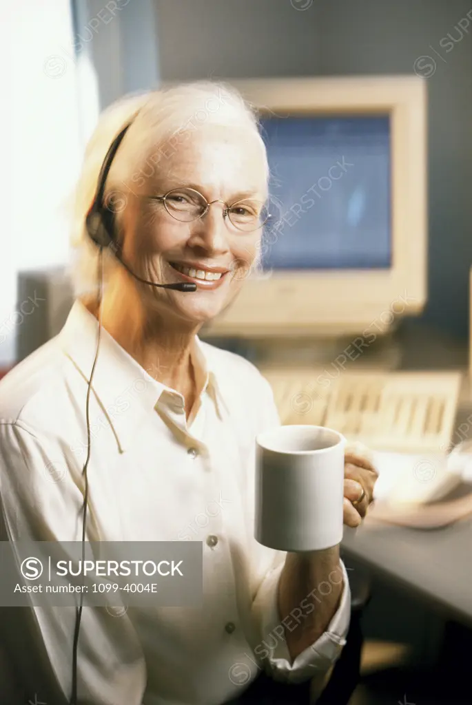Female customer service representative wearing a headset and smiling