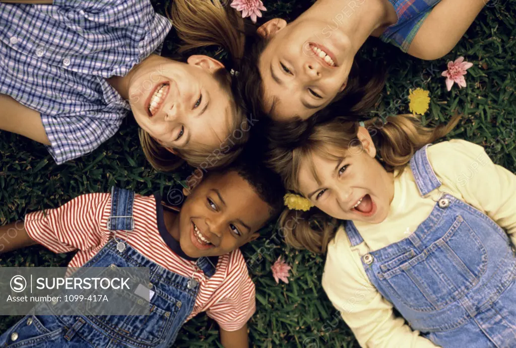 Portrait of a group of children lying down