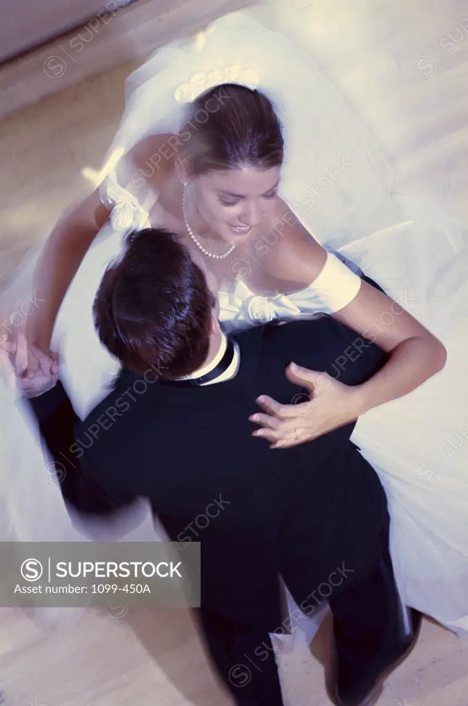 High angle view of a newlywed couple dancing