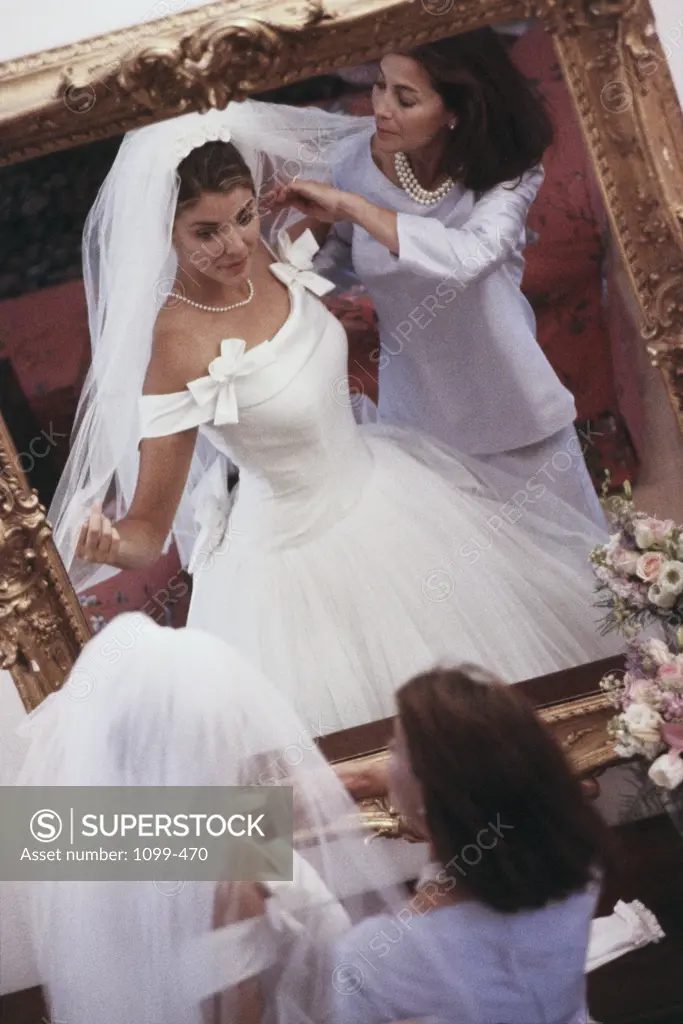 High angle view of a mature woman adjusting a bridal veil