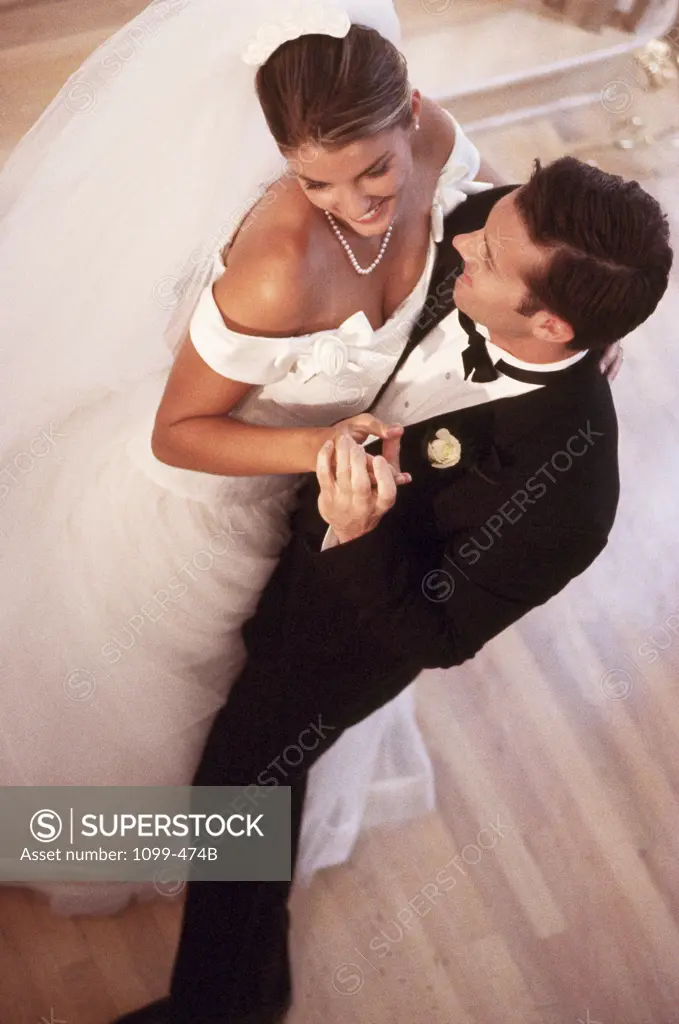 High angle view of a newlywed couple dancing