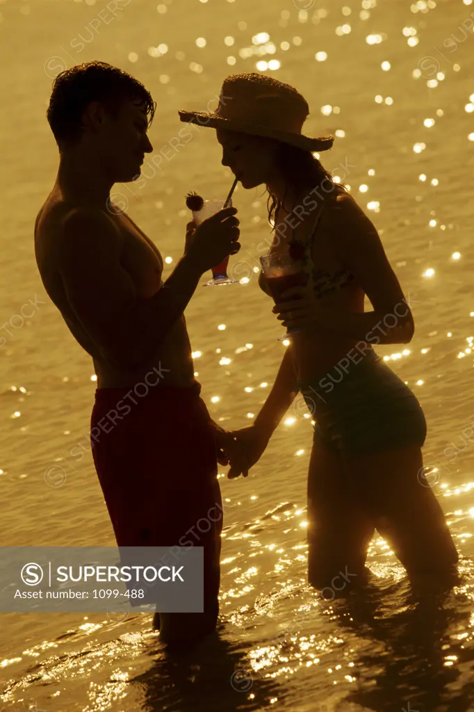 Silhouette of a young couple on the beach
