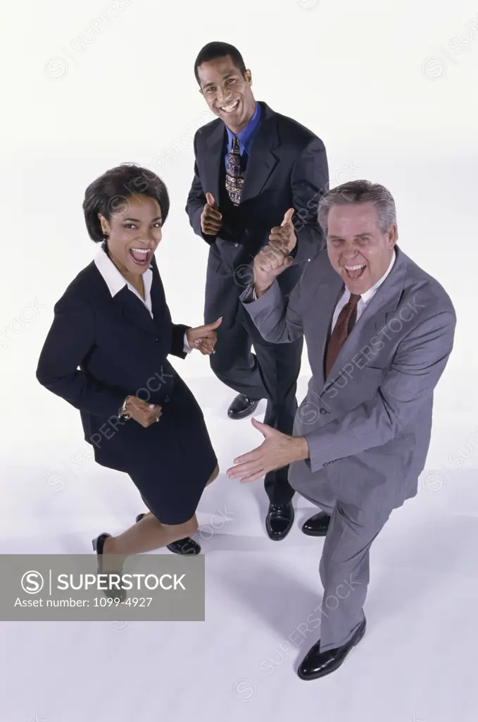 Two businessmen and a businesswoman acting excited