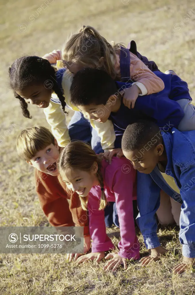 Group of children making a human pyramid