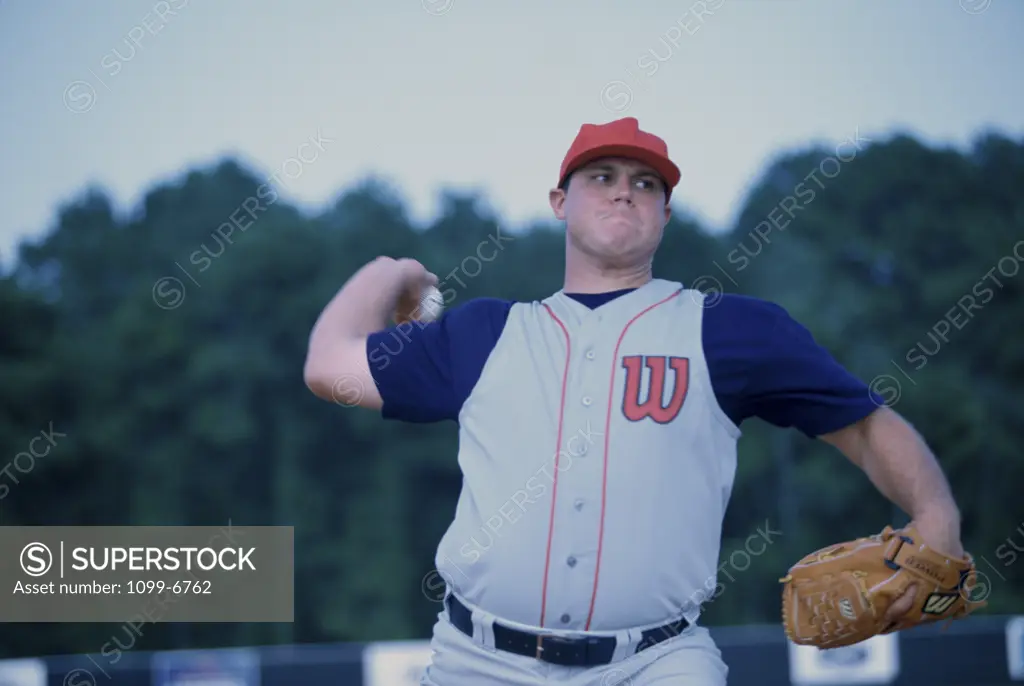 Baseball player throwing a baseball