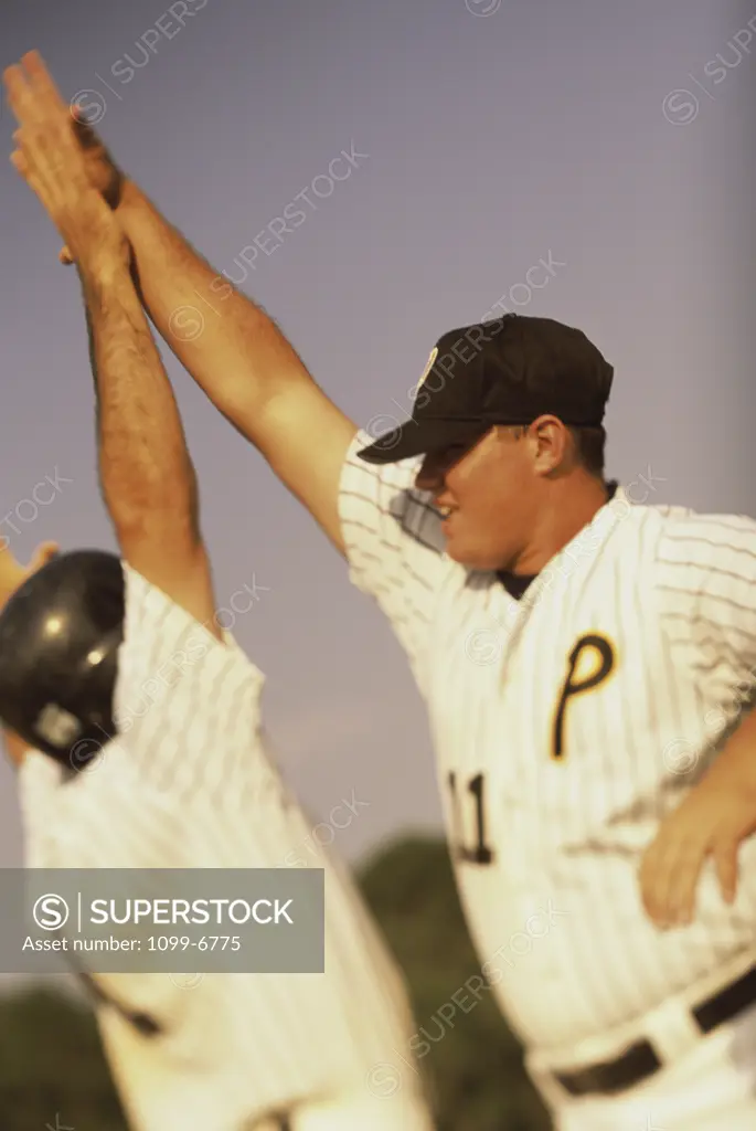 Two baseball players celebrating