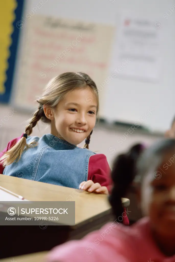 Girl smiling in a classroom