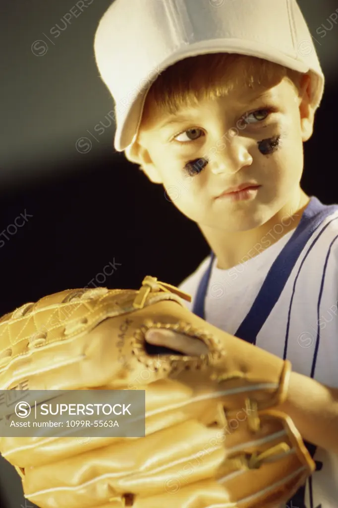 Close-up of a boy in a baseball uniform