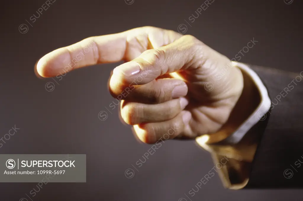 Close-up of a person pointing forward