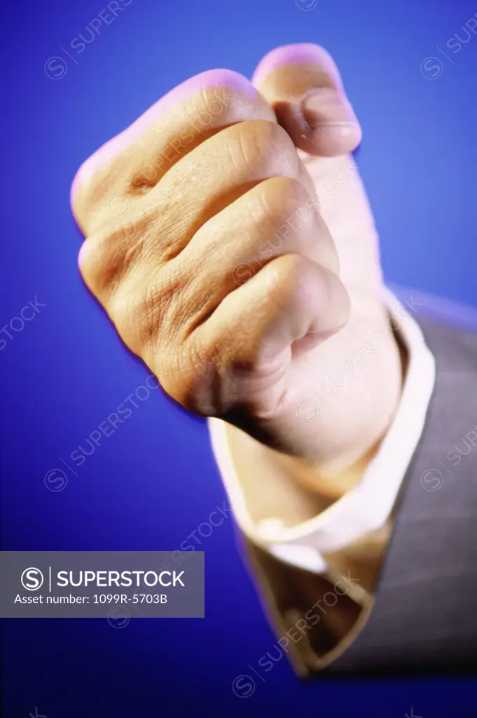 Close-up of a person's hand making a fist