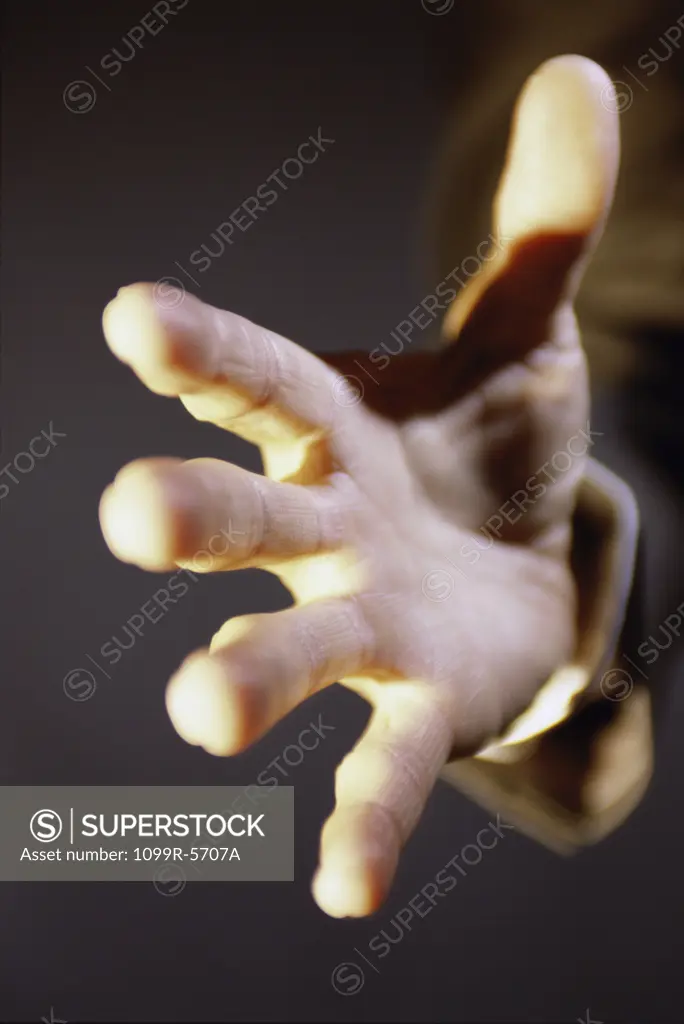 Close-up of a person's hand reaching out
