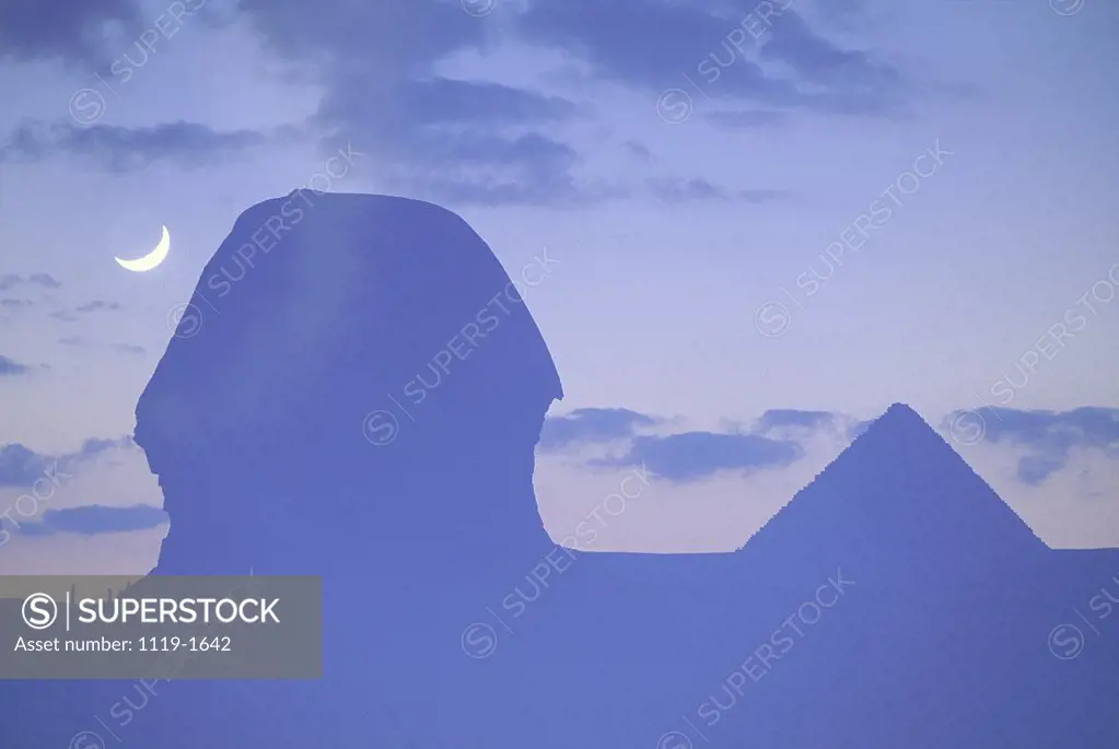 Silhouette of a sphinx and pyramid at dusk, Great Sphinx, Giza, Egypt