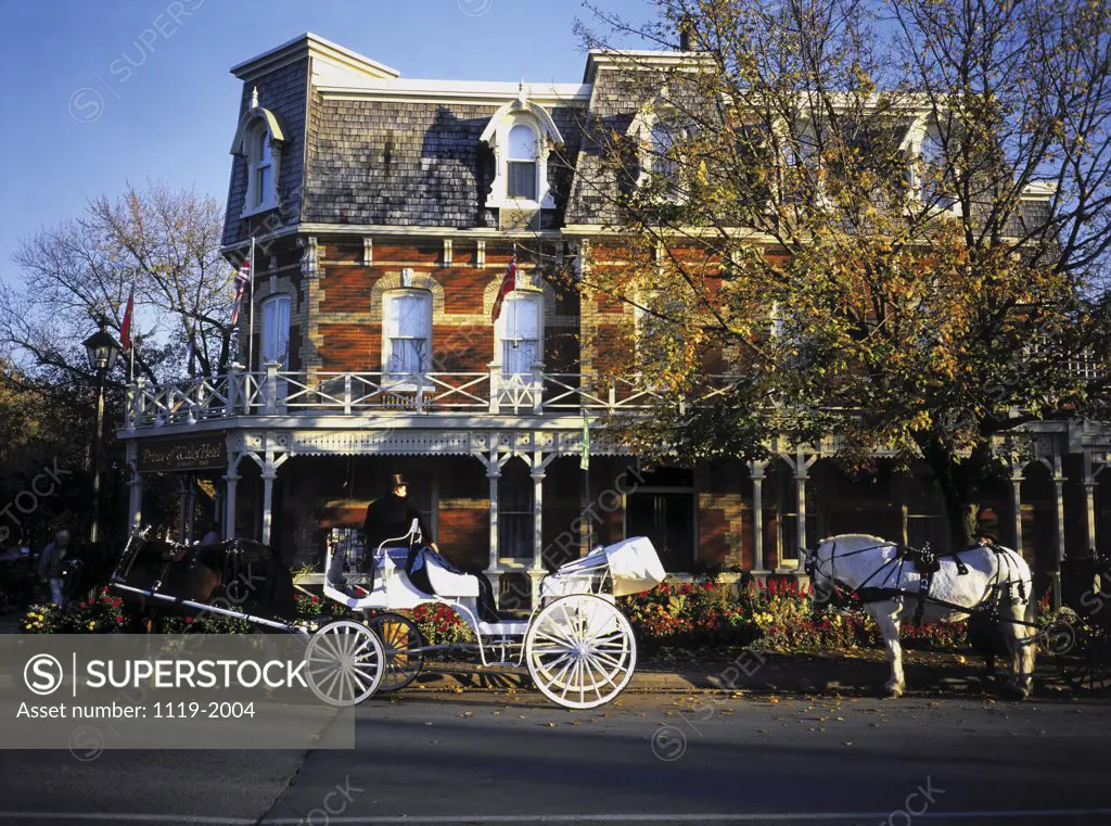 Carriages in front of a house, Quebec, Canada