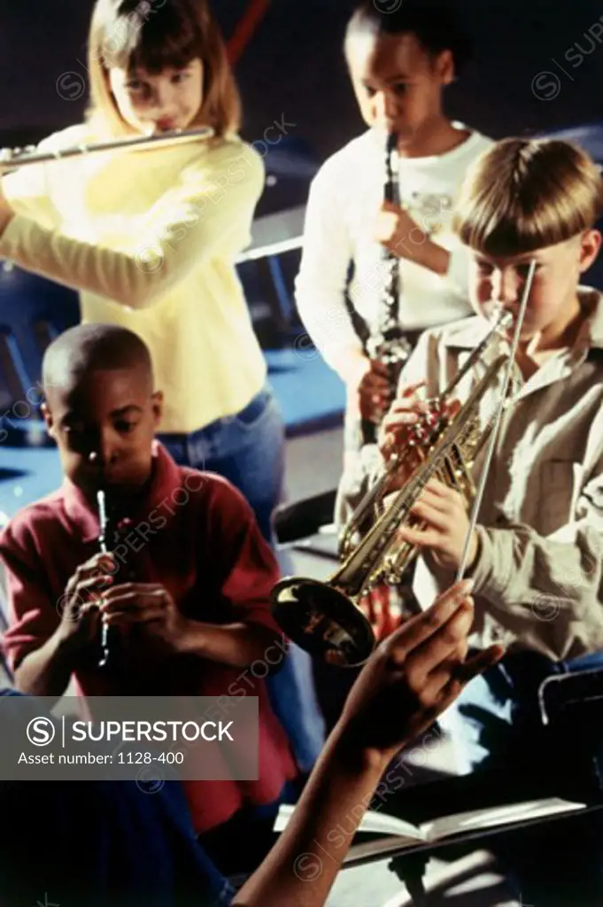 Four children learning music